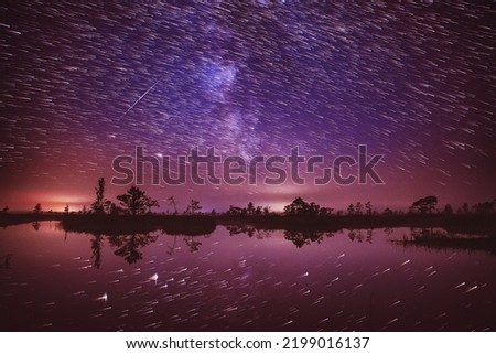 Bright Dramatic Trails Of Stars And Meteors. Fantastic Stars Effect In Sky. Unusual Dusk Natural Background. Sunset Trace Of Sun Above Rural Landscape. Soft Colors. Abstract Dream View.
