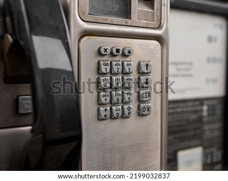 public telephone key pad in a call box UK Royalty-Free Stock Photo #2199032837