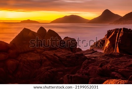 Fog in the mountains at dawn. Beautiful sunrise over mountains in early morning fog. Mountain fog at dawn. Sunrise mountain fog landscape Royalty-Free Stock Photo #2199052031