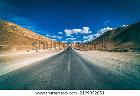 Highway through the canyon desert. Open range highway road. Asphalt road in desert. Highway road panorama Royalty-Free Stock Photo #2199052051