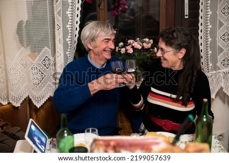Married Caucasian Senior Couple Celebrating Birthday Together in Domestic kitchen During