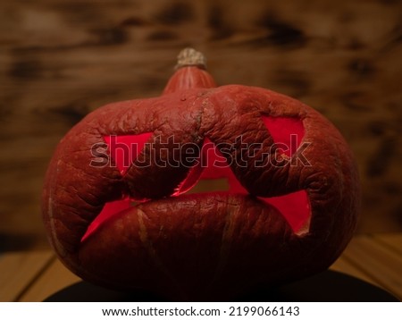 Pumpkin on a wooden background. Halloween pumpkin. Close-up.