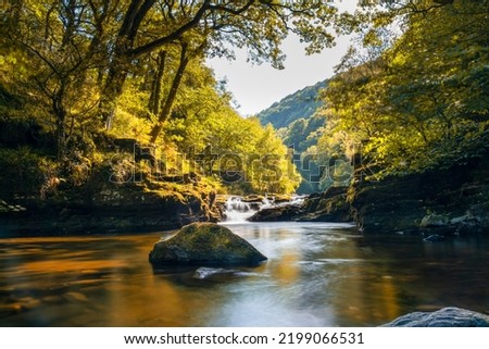 A view of the East Lyn River and Watersmeet in Lynmouth in North Devon in autumn Royalty-Free Stock Photo #2199066531