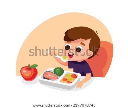 Boy eating healthy eco food with spoon sitting at the table. Child having meal for breakfast, lunch. Boy eats apple for supper, dinner or snack. Hungry kid have a meal. Meals are served to child. Royalty-Free Stock Photo #2199070743