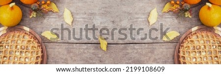 Thanksgiving background. Thanksgiving composition. Thanksgiving pumpkins on wooden background. 
Pumpkin pie. Banner. copy space
