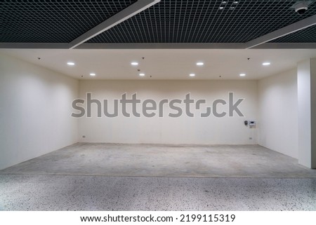 Front view of Empty booth, Horizontal free space for rent for sale or showing product event in shopping mall, lighting on ceiling Royalty-Free Stock Photo #2199115319