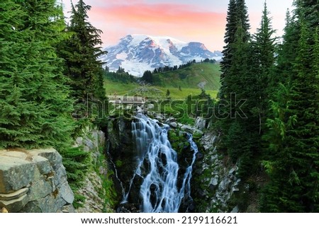 Myrtle Falls and Mt Rainier at sunrise. Myrtle Falls is located along Skyline Trail in the Paradise area of Mount Rainier National Park and is reached by hiking the trail 0.5 miles. Royalty-Free Stock Photo #2199116621