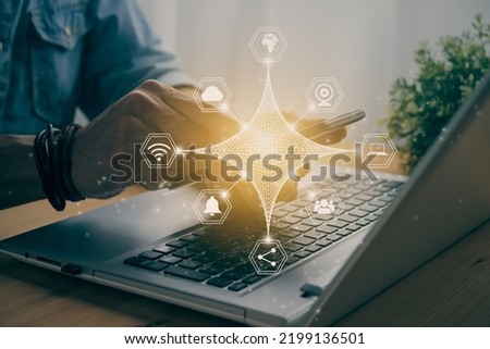 Casual Businessman Touching Smart Phone or Mobile Phone Screen on Laptop Computer and 4 Angle Spirograph Hexagon Communication Sign. Online Social Media Contact and Internet Concept in Vintage Tone