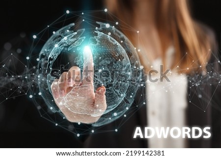 Business, Technology, Internet and network concept. Young businessman working on a virtual screen of the future and sees the inscription: AdWords