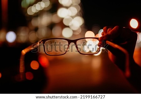 Astigmatic blur vision glasses eyes bokeh Royalty-Free Stock Photo #2199166727