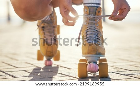 Yellow roller skates shoes of woman in summer outdoor travel, journey or fun activity for the holiday. Cool, trendy or funky gen z person prepare or tie laces on ground in quad skating with sunshine Royalty-Free Stock Photo #2199169955