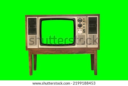 Retro old television with blank green screen standing isolated on green background and clipping path.