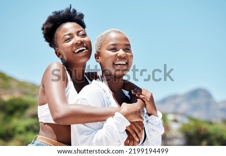 Smile, love and gay or lesbian with black couple women bonding at beach or sea in summer. Freedom, happy and LGBT portrait of fun friends or girlfriend on holiday, vacation or honeymoon by the coast