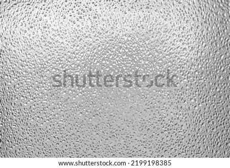 The texture of the drops on the window, the wet fogged glass. Royalty-Free Stock Photo #2199198385