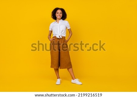 Full size photo of pretty good mood lady wear stylish outfit picture for ad shop blank space isolated on yellow color background