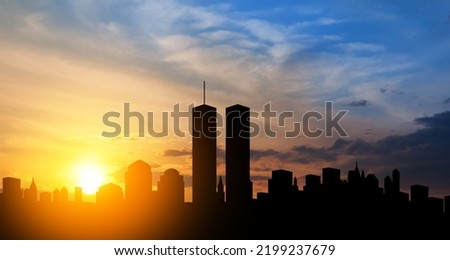 New York skyline silhouette with Twin Towers at sunset. 09.11.2001 American Patriot Day banner. Royalty-Free Stock Photo #2199237679