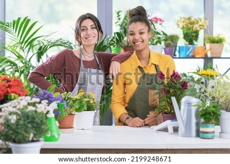 Young female florists working together at the flower shop, small business and entrepreneurship concept