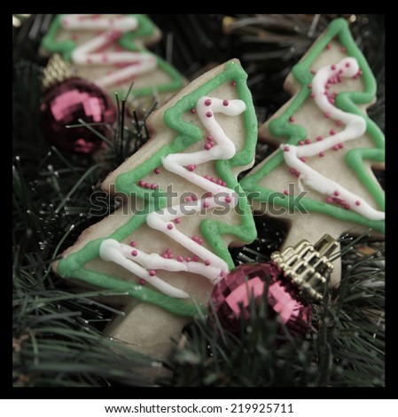 Christmas tree cookies with fir and christmas balls.  Crossed process to look like an instant picture.