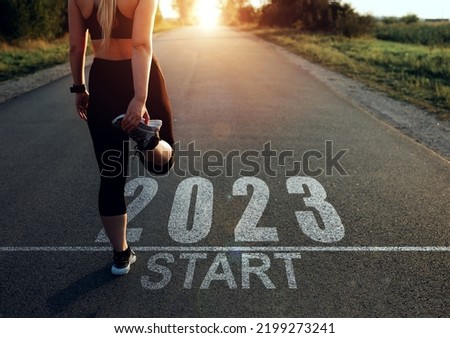 Sports girl who wants to start the year 2023. Concept of new professional achievements in the new year and success. New Year 2023 with new ambitions, challenge, plans, goals and visions. Royalty-Free Stock Photo #2199273241