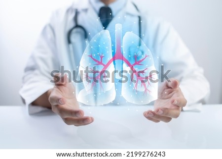 Pulmonologist doctor showing off virtual screen of lung medical issue. Healthcare medical technology concept. Royalty-Free Stock Photo #2199276243