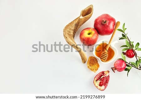 Rosh hashanah, jewish New Year holiday concept. Pomegranate, apples and honey traditional products for celebration Royalty-Free Stock Photo #2199276899