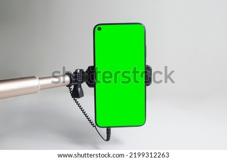 Monopod for selfie with smart phone. Selfie stick with smartphone isolated on white background. Selfie sticks with horizontal, vertical screen, display of smartphone, without it.