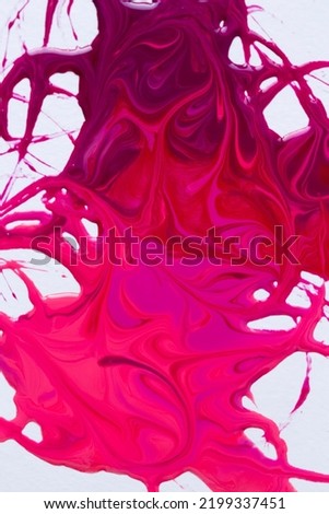 Pink nail polish dripping gradient, close up photo of liquid paint on white background