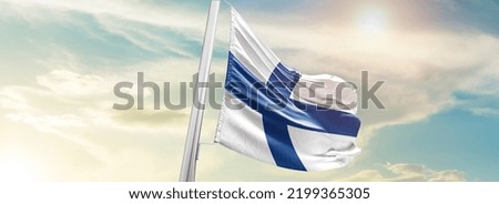Finland national flag waving in beautiful sky.