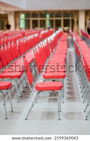 Long rows of red chairs were prepared for those who attended the event.