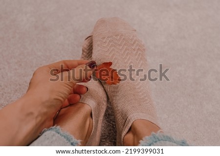 Close up of brown cotton socks autumn cozy clothing.