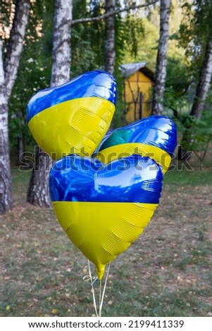 hot air balloon with blue and yellow flag of ukraine