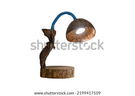 Lantern made from coconut shells, dragging old wood, old cutting board, environmentally friendly concept. Photo isolated on White background .This has clipping path.