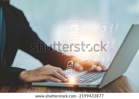Businessman using computer Document Management System (DMS), online documentation database process automation to efficiently manage files