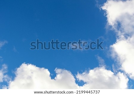 Background of blue sky and clouds. Space for text on blue sky background.