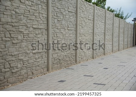 Concrete pattern fence and block paving tiles