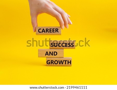 Career success and growth symbol. Wooden blocks with words Career success and growth. Beautiful yellow background. Businessman hand. Business and Career success and growth concept. Copy space.