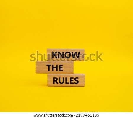 Know the rules symbol. Wooden blocks with words Know the rules. Beautiful yellow background. Business and Know the rules concept. Copy space. Royalty-Free Stock Photo #2199461135