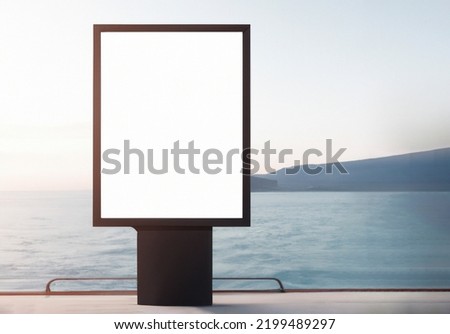 Blank billboard on seaside, front view