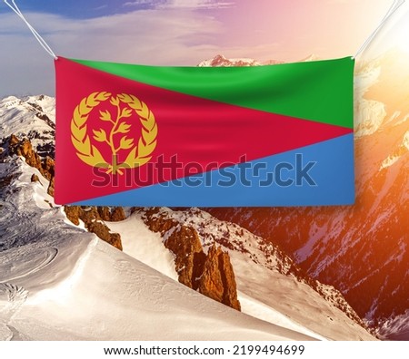 Eritrea national flag cloth fabric waving on beautiful sky.