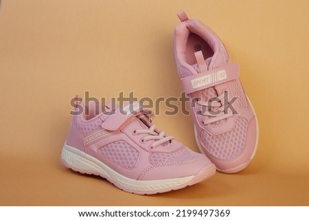 Children's shoes, on a flat background. Royalty-Free Stock Photo #2199497369