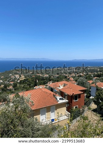 ocean view from mountain in Greece, tiled orange roofs