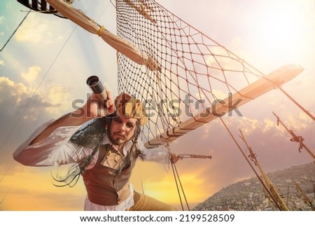 funny the pirate captain traveler  discoverer and explorer on the vintage pirate ship  Royalty-Free Stock Photo #2199528509