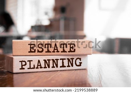 Estate Planning text concept written on wooden blocks lying on a table Royalty-Free Stock Photo #2199538889