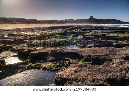 May 12022,the north coast of Taiwan,the seaside at dusk,showing the contrast of cold and warm with slow shutter speed and color temperature,,  nature, landscape, scenic, travel, tourism,seaside rocks
