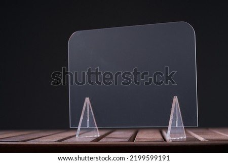 blank transparent placard or acrylic glass with stand for copy space