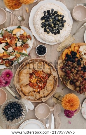 picnic snacks top view. decorated served table with different food. Royalty-Free Stock Photo #2199599695