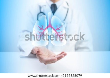 Pulmonologist doctor showing off virtual screen of lung medical issue. Healthcare medical technology concept. Royalty-Free Stock Photo #2199628079