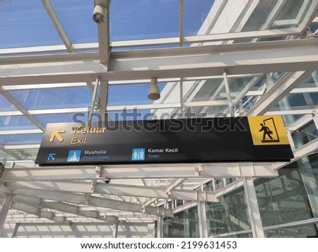 Bilingual signage at the airport in Indonesia