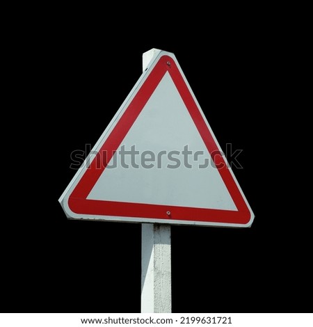 Real side view road sign isolated in Black background.