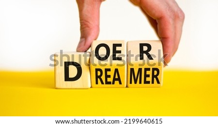 Doer or dreamer symbol. Concept words Doer or dreamer on wooden cubes. Businessman hand. Beautiful yellow table white background. Business and doer or dreamer concept. Copy space. Royalty-Free Stock Photo #2199640615